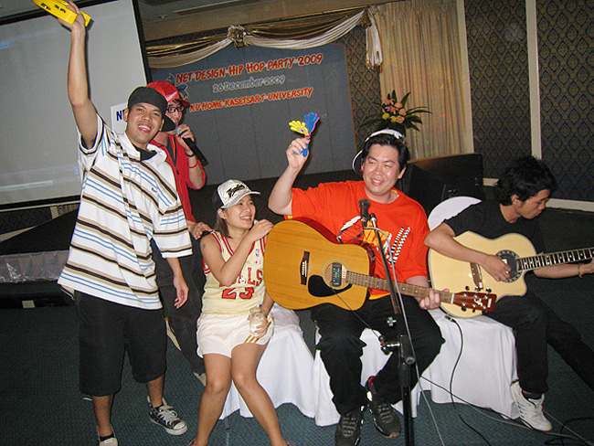 Dr. Wasin Pirom playing guitar